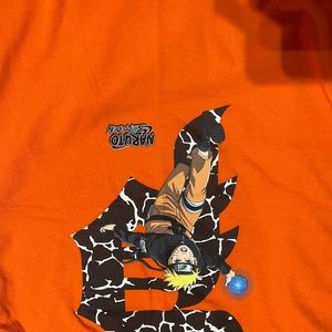 Bunch of primitive Ts and sweaters.